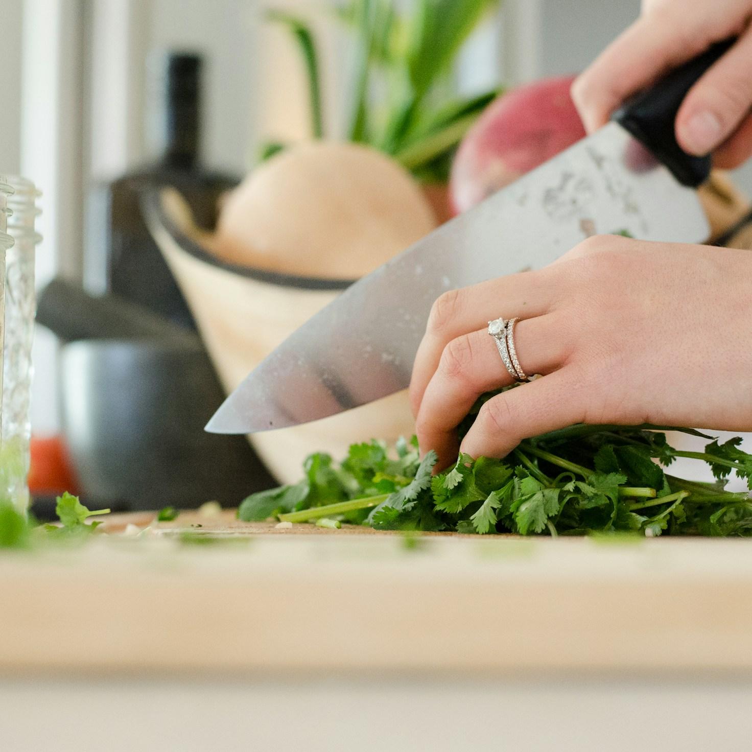 Community members collaborating in a modern kitchen space, sharing recipes and cooking techniques